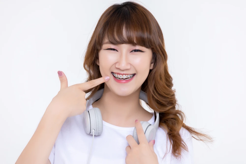 Person smiling while wearing braces